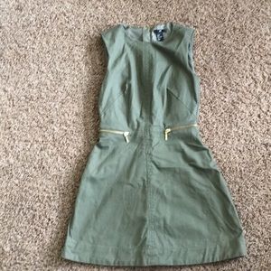 Army green sleeveless mini dress with gold zips
